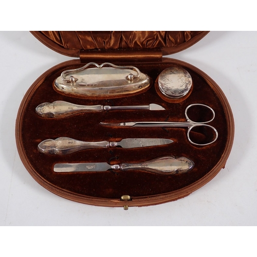 215 - A cased six piece silver manicure set, Birmingham 1918 by Green & Cadbury Ltd