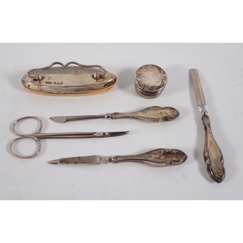 215 - A cased six piece silver manicure set, Birmingham 1918 by Green & Cadbury Ltd