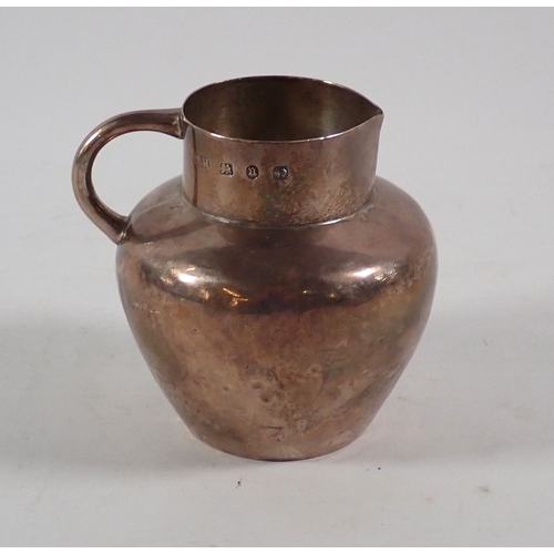 216 - An Arts & Crafts silver sparrow beak cream jug by Thomas Hayes, Birmingham 1894, 7cm high, 62g