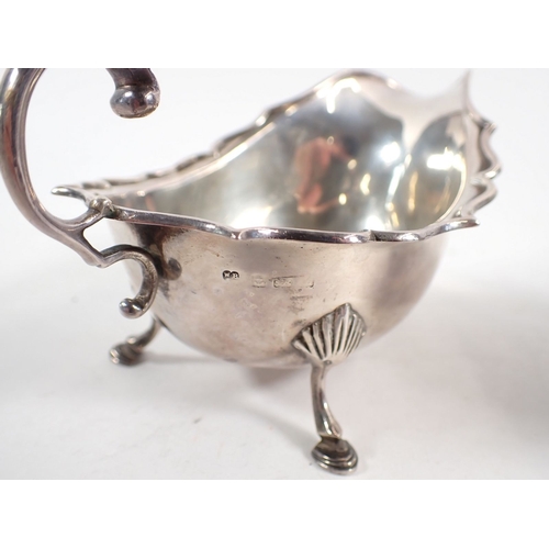 220 - A silver sauce boat, Birmingham 1924 and milk jug with wavy edge, Birmingham 1938, 150g