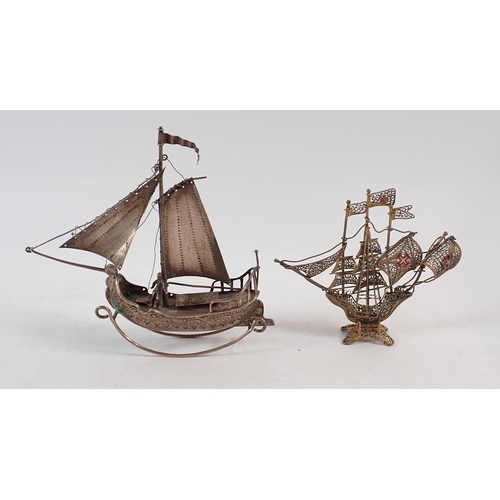 221 - A white metal filigree rickshaw, two boats and four miniature chairs, tallest item 12cm high