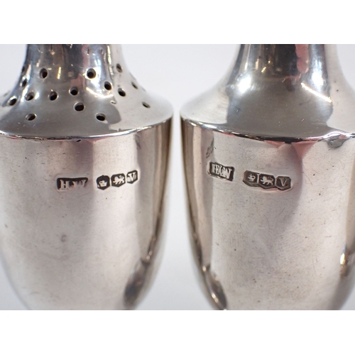 232 - A silver cruet set by Lee & Wigfull, Sheffield 1937, 162g and a pair of silver plate knife rests, 9c... 