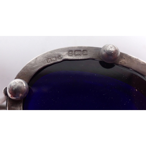 233 - A silver group to include mustard pot, Birmingham 1887, salt, Birmingham 1901 and a napkin ring, Bir... 