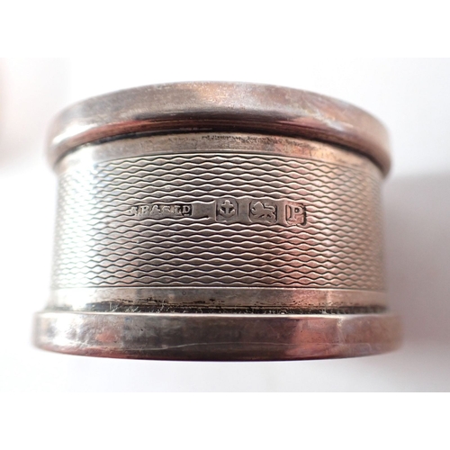 234 - Nine silver napkin rings, 222g