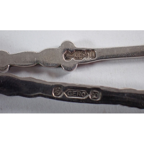 236 - A group of mainly continental silver and white metal including three 830 silver 'Venezuela' souvenir... 