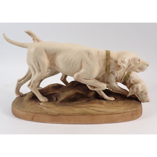 26 - A Royal Dux pair of hunting dogs, 30cm long