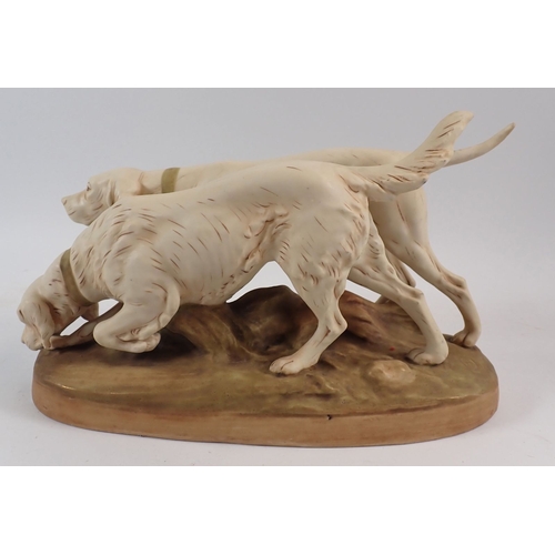 26 - A Royal Dux pair of hunting dogs, 30cm long