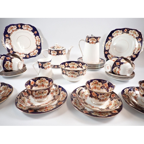36 - A Royal Albert 1920's tea set comprising teapot with stand, coffee pot, milk jug, sugar, twelve cups... 