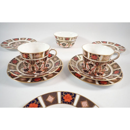 37 - A pair of Royal Crown Derby Imari tea cups and sugar bowl plus five tea plates, 16cm diameter