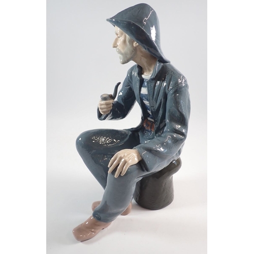 41 - A Nao pottery fisherman seated with pipe, 39cm tall
