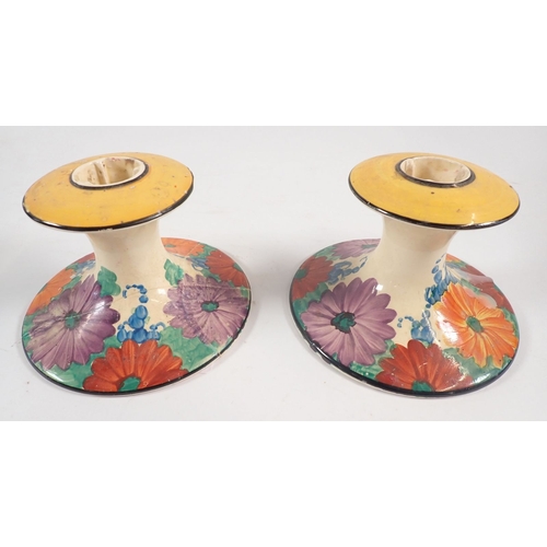 44 - Clarice Cliff 'Gay Day' candlesticks, a/f plus a Clarice Cliff Fantasque Bizarre beaker/cup in the b... 