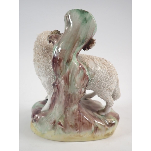 48 - A Victorian Staffordshire sheep spill vase, 12cm tall