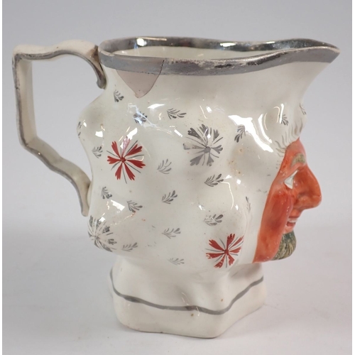 54 - A Staffordshire character jug with silver lustre rim - a/f, 11.5cm tall