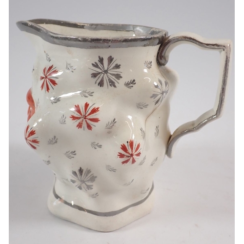 54 - A Staffordshire character jug with silver lustre rim - a/f, 11.5cm tall