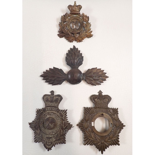 606 - A collection of relics to the Crimea War - spent bullets with various period helmet plates, Russia a... 