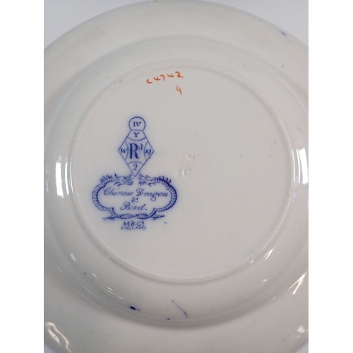 31 - A quantity of Minton and Co Chinese Dragon and Bird design dinner ware comprising thirteen dinner pl... 