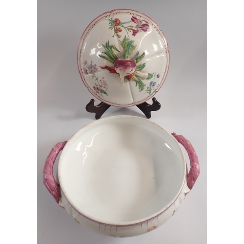 33 - A French Faience floral painted tureen and stand, 46cm long