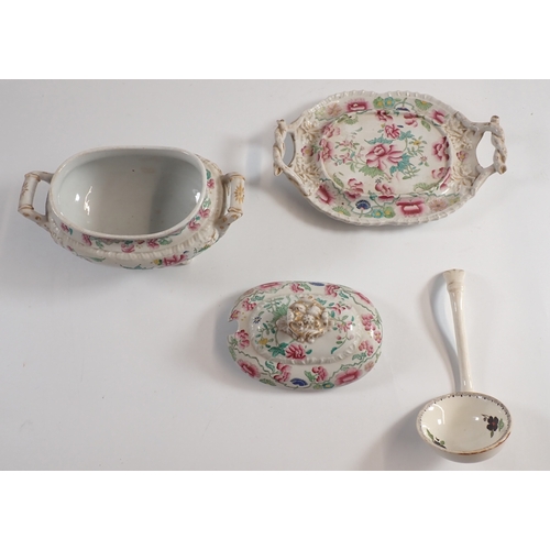 34 - A Victorian small ironstone tureen and stand with ladle and lid painted flowers, 24cm wide