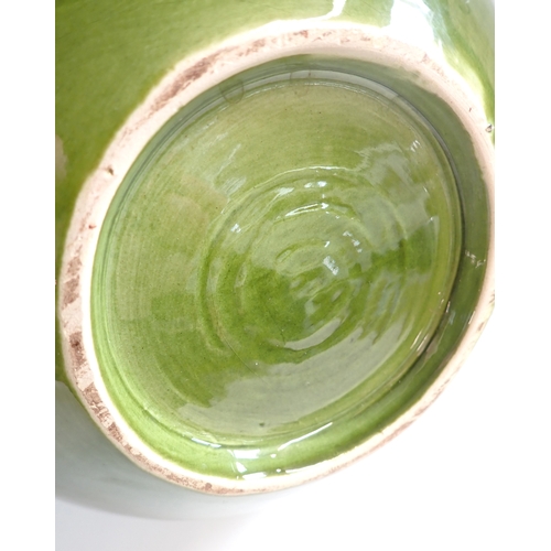 38 - A set of three green pottery vases, 28cm plus a smaller vase