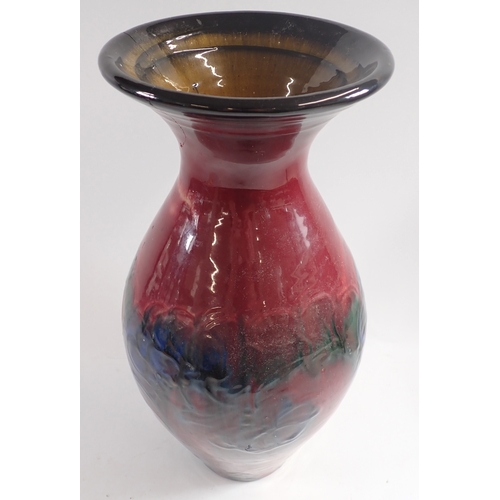 40 - A Danico ceramic vase with a red ground and blue flowers - a/f, 41cm tall