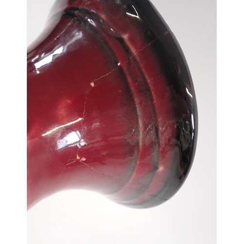 40 - A Danico ceramic vase with a red ground and blue flowers - a/f, 41cm tall