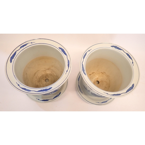 5 - A pair of Chinese blue and white jardinieres decorated cranes each on a Chinese blue and white plate... 