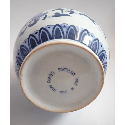 7 - A floral blue and white ginger jar with cover and a blue and white Chinese vase, 35cm tall