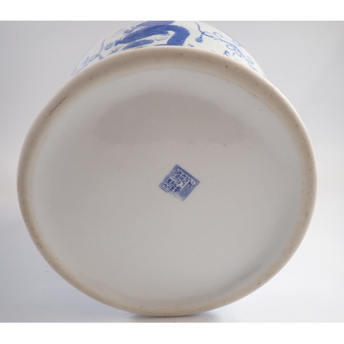 8 - A modern Chinese blue and white ginger jar and cover decorated dragon motifs, 45cm tall