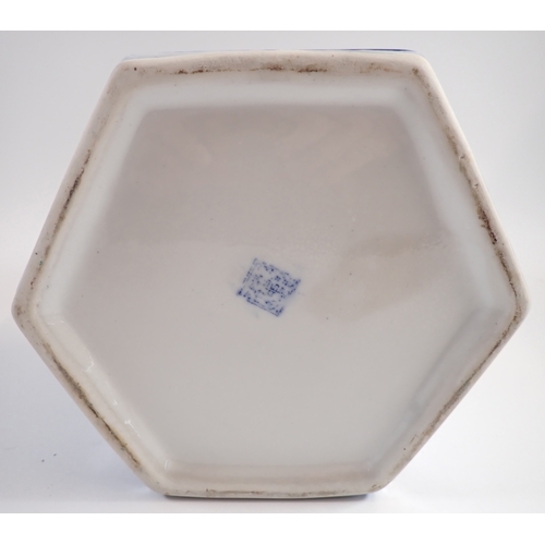 9 - A modern Chinese blue and white hexagonal ginger jar decorated birds and mountain scenes, 29cm tall