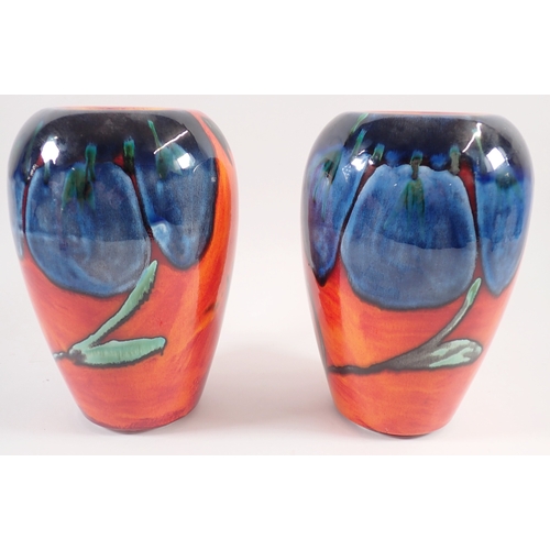 10 - A pair of Poole Pottery Himalayan Poppy vases, 22cm