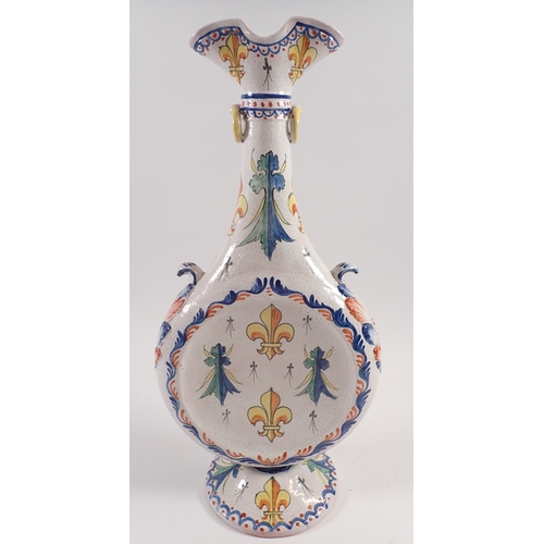 19 - A tall faience double spouted moon vase with armorial decoration, 39cm long
