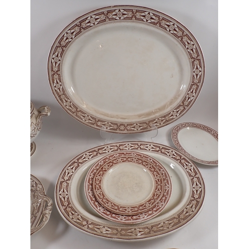 24 - Two large Victorian brown printed meat plates, largest 55cm wide and four other plates 'Tudor' by P ... 
