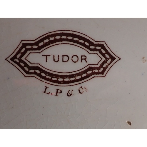 24 - Two large Victorian brown printed meat plates, largest 55cm wide and four other plates 'Tudor' by P ... 
