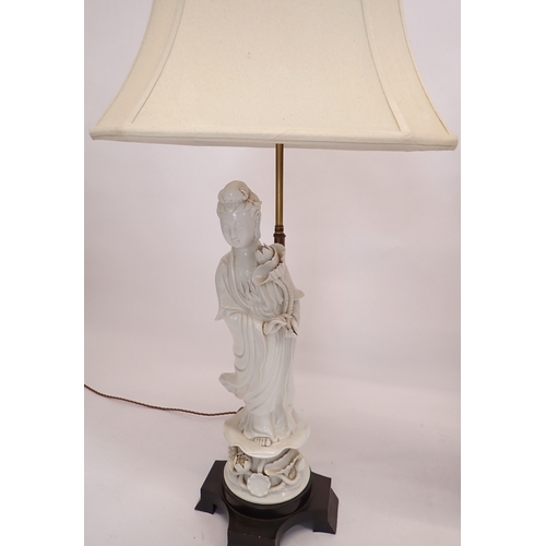 3 - A pair of large Chinese blanc de chine porcelain figurative table lamps and shades, 97cm tall