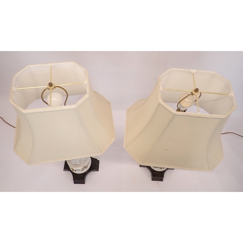 3 - A pair of large Chinese blanc de chine porcelain figurative table lamps and shades, 97cm tall