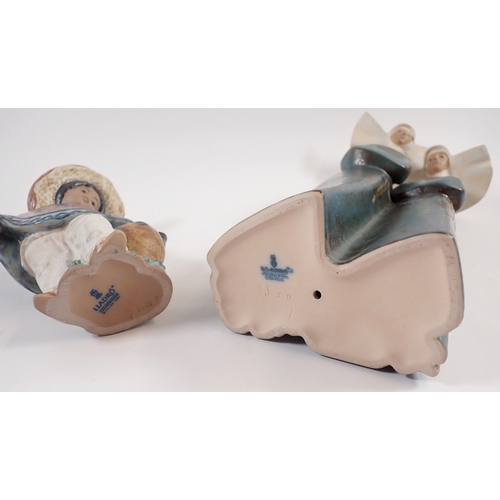 32 - A Lladro figure of two nuns, 34cm and one of a Mexican boy 'Pedro with Jug' No.12141 - both boxed