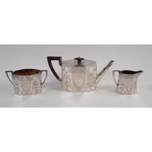 326 - A Victorian silver three piece tea service, octagonal form with foliage engraved decoration in origi... 