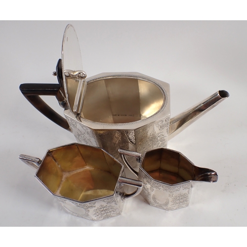 326 - A Victorian silver three piece tea service, octagonal form with foliage engraved decoration in origi... 