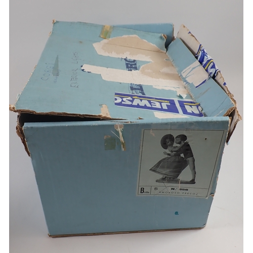 37 - A Lladro group of boy kissing girl, No.856, 24cm - boxed but tatty