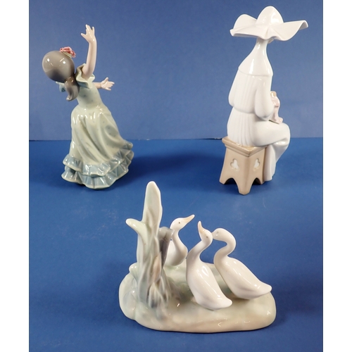 39 - Three Lladro groups to include a nun doing needlework, 20cm tall - boxed, a dancing girl and geese
