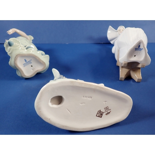 39 - Three Lladro groups to include a nun doing needlework, 20cm tall - boxed, a dancing girl and geese