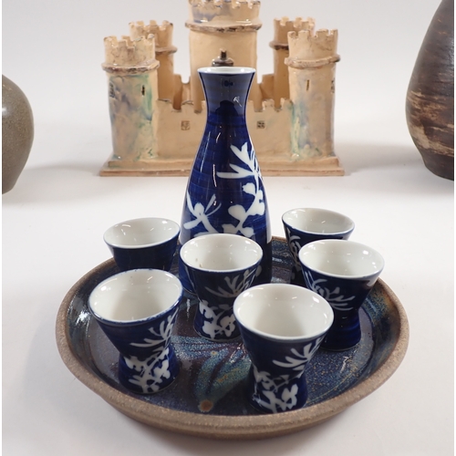 56 - A pottery castle - 25 x 19cm, a Japanese blue saki set, two Studio pottery vases and a tray