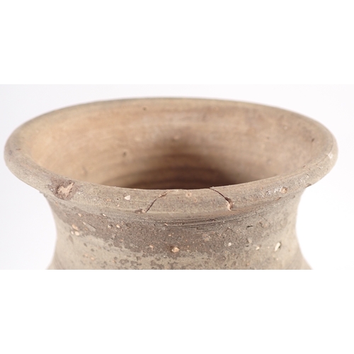 57 - A medieval pottery vase, one handle missing, 26cm tall