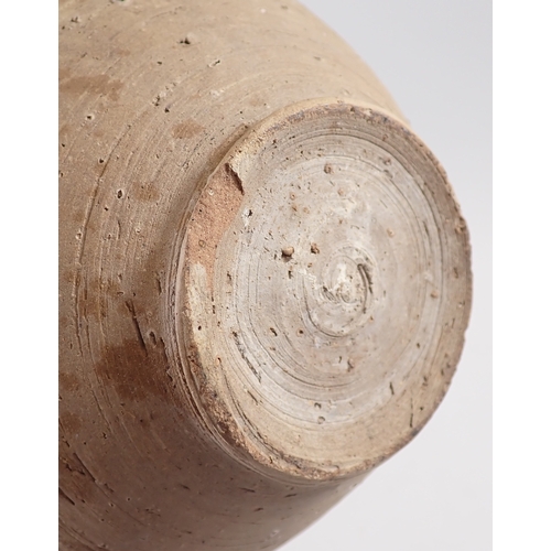 57 - A medieval pottery vase, one handle missing, 26cm tall