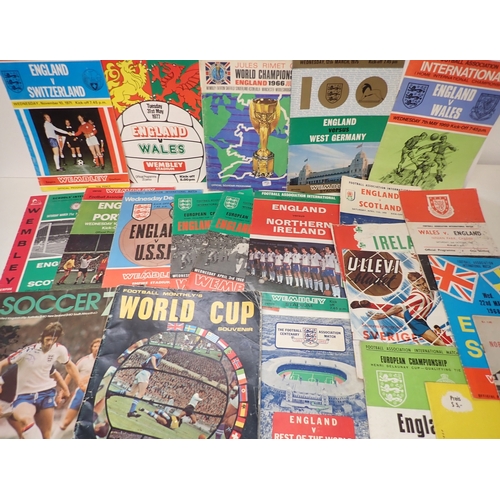643 - A group of England international football programmes including World Cup 1966 official souvenir prog... 