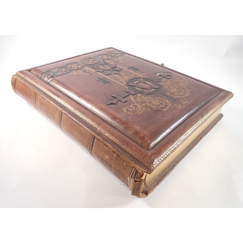 653 - A Victorian leather and gilt photograph album - empty
