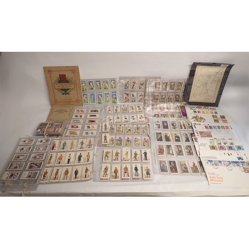 669 - A quantity of cigarette cards and stamps