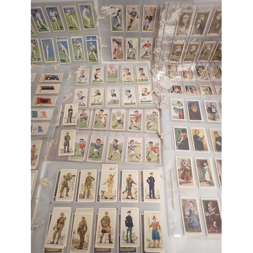 669 - A quantity of cigarette cards and stamps