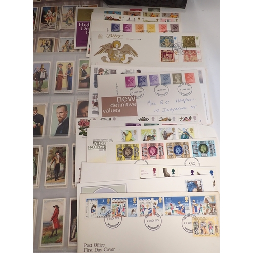 669 - A quantity of cigarette cards and stamps