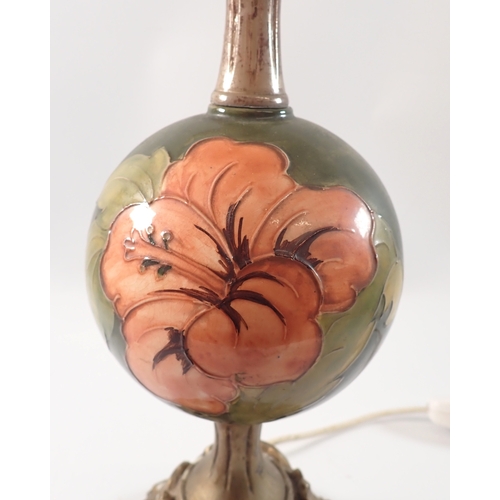 13 - A Moorcroft Hibiscus lamp with resin mounts, 65cm tall with shade